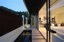 Master bedroom outdoor tub area in the evening